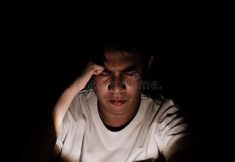 Asian Miserable Depressed Man Sitting Alone in Dark Background. Stock ...