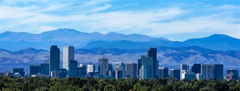 Denver Colorado Skyline Against the Rockies - JL Denver