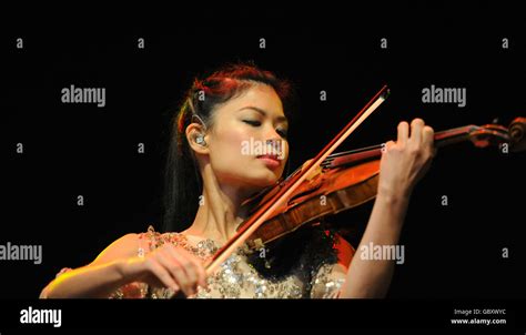 Violinist Vanessa Mae performing on stage at Westonbirt Arboretum ...