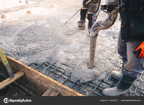 Concrete pouring during commercial concreting floors of building ...