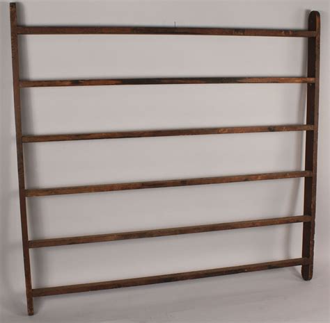 Lot 680: Antique hanging quilt rack