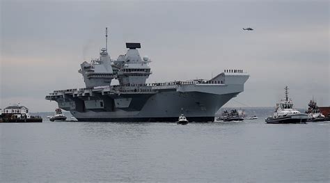 Britain’s new aircraft carrier enters service amid controversy and ...