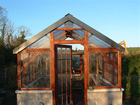 Timber frame Greenhouse w recycled windows | Home greenhouse, Timber frame greenhouse, Wooden ...