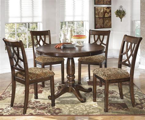 Signature Design by Ashley Leahlyn 5-Piece Cherry Finish Round Dining Table Set - Lapeer ...