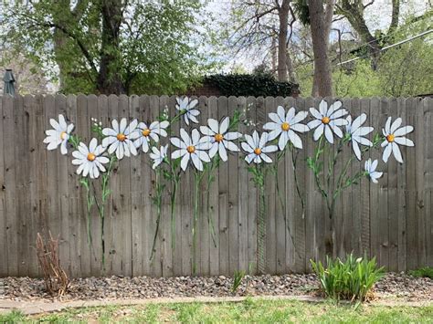 Painted flowers on fence – Artofit