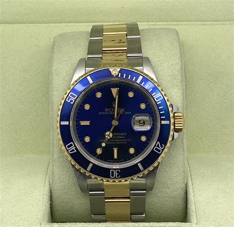 ROLEX SUBMARINER BLUE DIAL GOLD & STEEL 40MM - Gold & Ice Jewelry