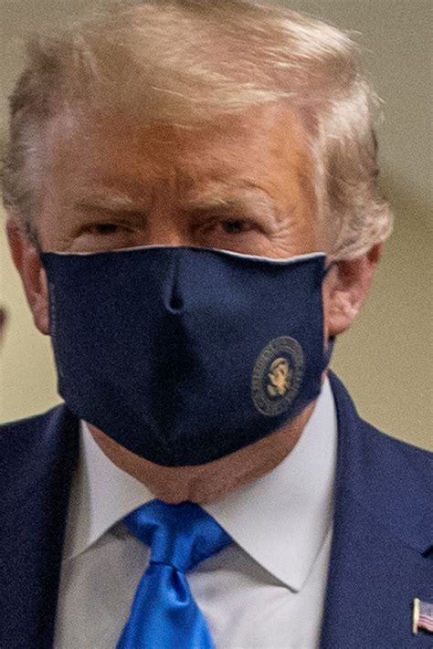 Trump wears mask on camera for first time as he visits military ...