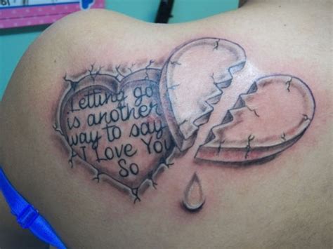 Grey Ink Broken Heart Pieces Tattoo On Back | Tattooshunt.com