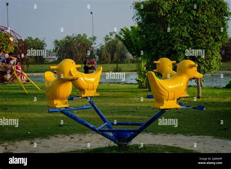 Fun ride for children in a park Stock Photo - Alamy