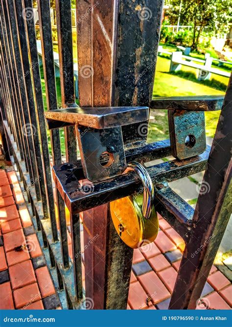 An Unlocked Gate of a Garden Stock Photo - Image of metallic, closed: 190796590