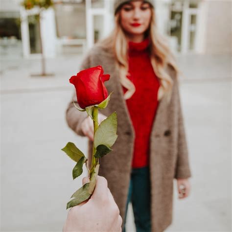 Free Photo | Hand giving rose to woman