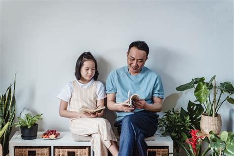 Photo of Man Using Laptop Sitting on Green Sofa · Free Stock Photo