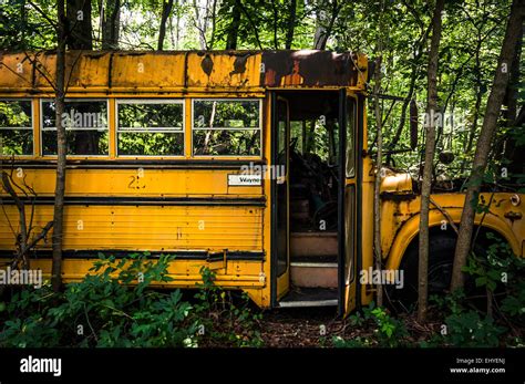 A rusty old school bus in a junkyard Stock Photo - Alamy