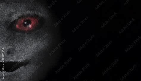 Scary creature with red eyes. Portrait of an alien or demon. A vision from a nightmare. Vampire ...