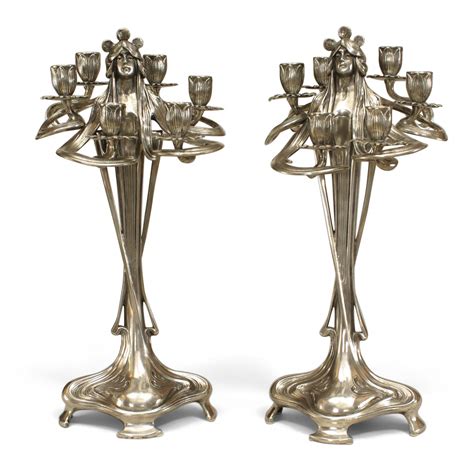 Art nouveau silvered pewter figural candelabras
