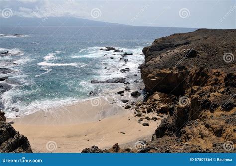 Cliff eroding into beach stock photo. Image of clouds - 57507864