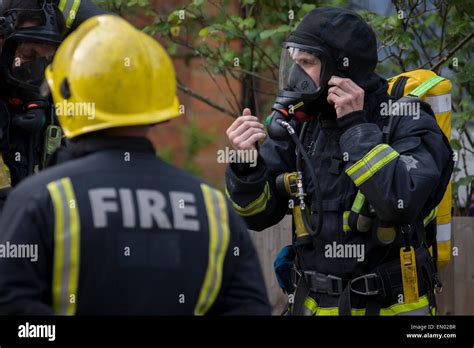 London Fire Brigade (LFB) firefighters attend a roof fire in Herne ...