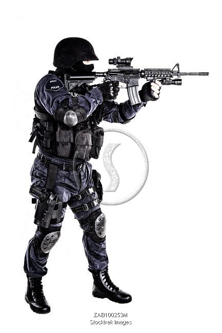 Special weapons and tactics (SWAT) team officer with his gun ...