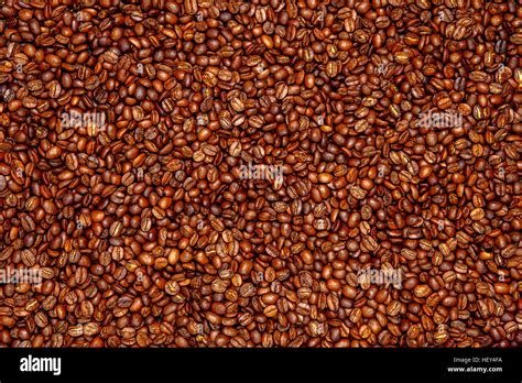 roasted coffee beans background Stock Photo - Alamy