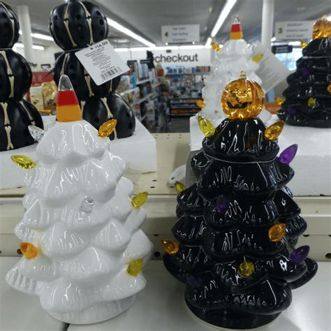 Holiday Confusion? White or black Christmas trees, with pumpkin and candy corn tree toppers. At ...