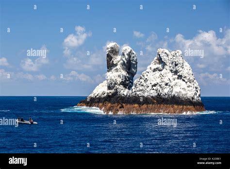 Roca Partida, a small rock island covered in white bird guano in the Revillagigedo Archipelago ...