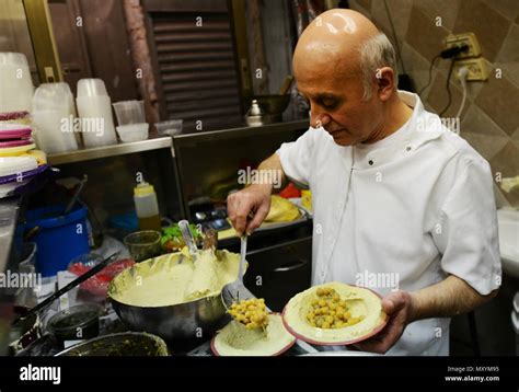 Ziyad Abu Shukri preparing his famous Hummus Stock Photo - Alamy