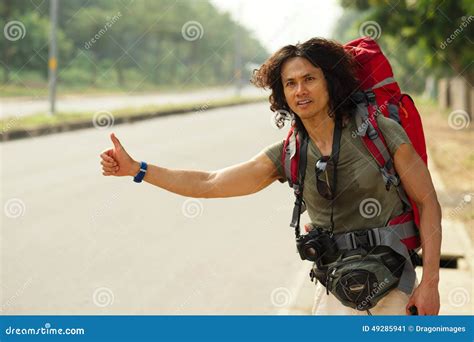 Hitchhiking man stock image. Image of discover, waiting - 49285941