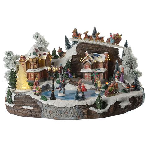 Christmas village with animated Santa Claus, skaters and | online sales on HOLYART.com