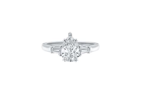 Discover the Classic Winston™, a pear-shaped engagement ring with tapered baguette side stones ...
