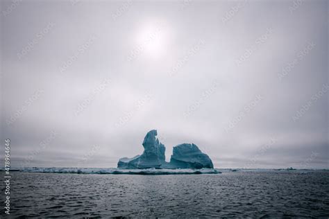 Icebergs floating in the melting sea ice in the Davis Strait. Stock ...