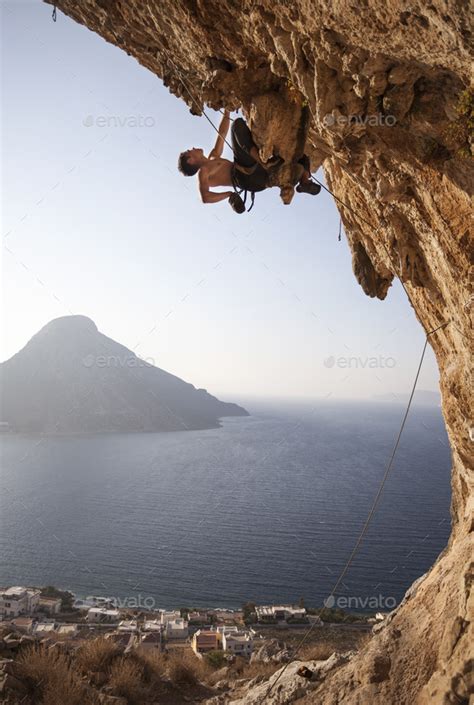 Rock climber on overhanging cliff Stock Photo by photobac | PhotoDune