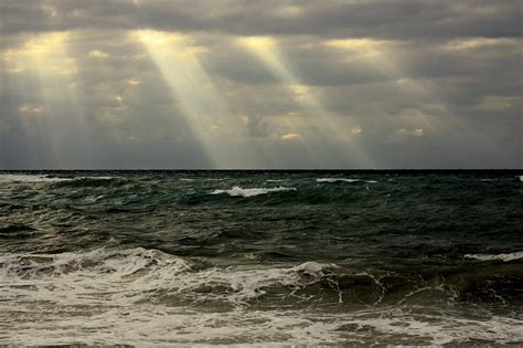 Sun rays over the ocean Photograph by Nick Mares