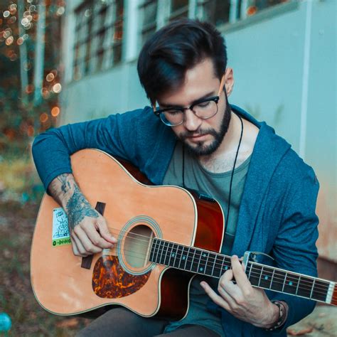 Photo of Man Playing Acoustic Guitar · Free Stock Photo