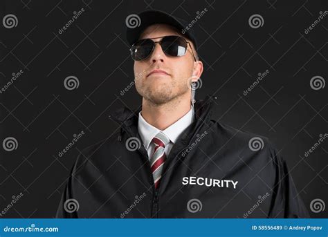 Bodyguard Wearing Sunglasses and Earpiece Stock Image - Image of ...