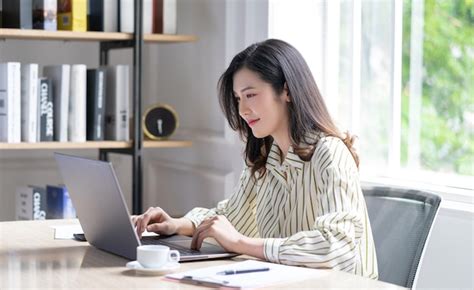 Premium Photo | Image of young Asian business woman working at office