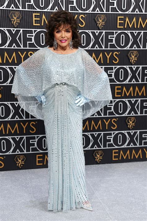 Joan Collins, 90, sparkles on the Emmys 2024 red carpet in blue ...