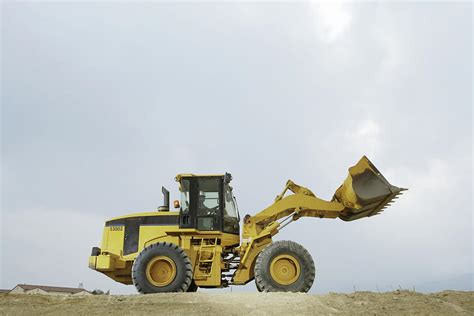 Construction Worker In Cab Of Bulldozer Photograph by Paul Taylor - Fine Art America