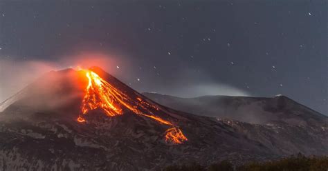 Mount Etna eruption sends lava spewing and huge column of gas into night sky - World News ...