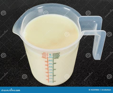 Half A Liter Of White Milk In A Transparent Jug Stock Photography | CartoonDealer.com #46309886