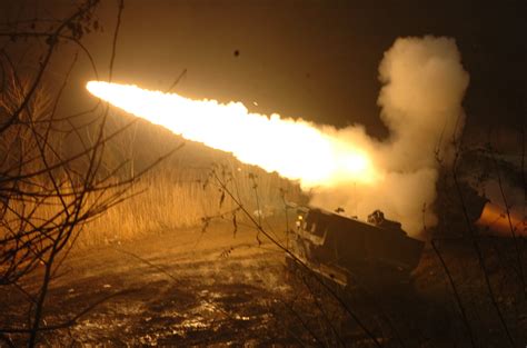 WHOOSH.. BOOM. A US Army M270 Multiple Rocket Launcher System lights up ...