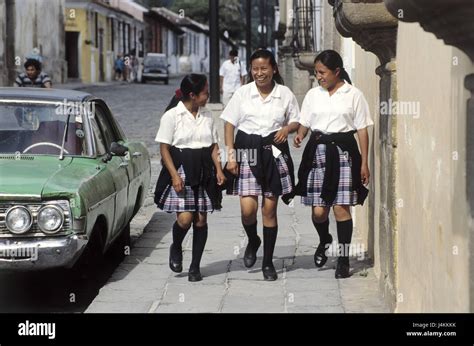 Guatemala, Sacatepequez, Antigua Guatemala, sidewalk, women, young ...