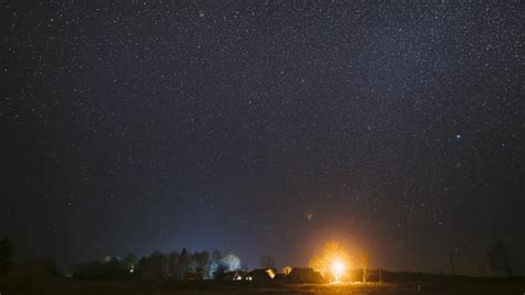 Real Night Sky Stars Above Old Village. Natural Starry Sky Above Rural Countryside Landscape In ...