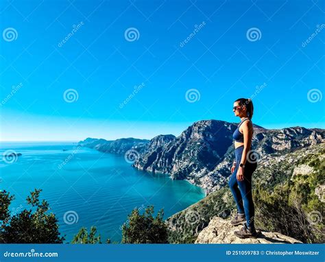 Woman in Sport Outfit Enjoying Scenic View from Hiking Trail between Positano and Praiano at the ...