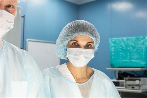 Portrait of a Doctor during Surgery in a Uniform and Medical Mask Stock Image - Image of group ...