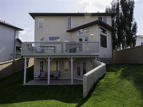 A raised balcony off the kitchen with a great lower patio from the walk-out basement. Photo by ...