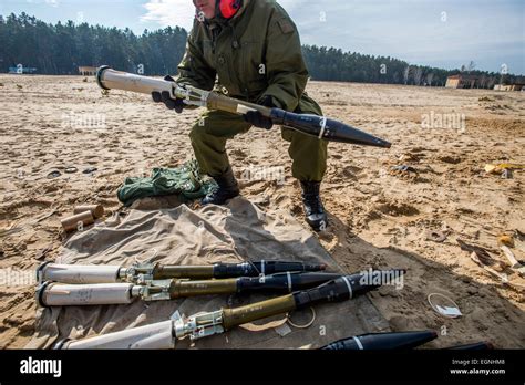 Cadet holds rocket of SPG recoilless gun during firing training with SPG recoilless guns and ...