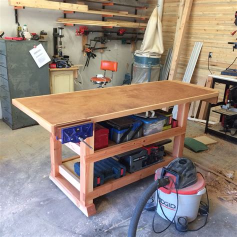 My workbench. Made from 2x4's, 4x4's, and a solid core door. End vise ...
