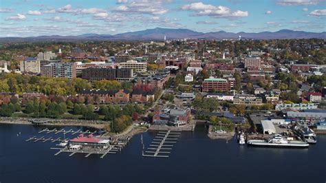 5.7K stock footage aerial video of orbiting city buildings and Burlington Community Boathouse ...