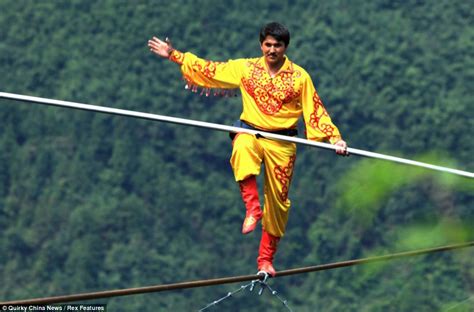 Just passing by: Trio of tightrope walkers breaks world record by crossing paths 1,150 feet up ...