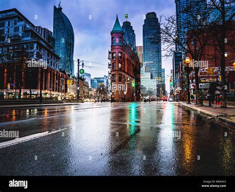 blend of old and modern in rainy city street Stock Photo - Alamy